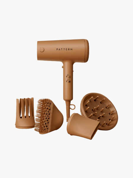 Pattern The Blow Dryer in branded component with multiple attachments on a light gray background