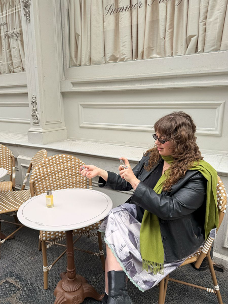 Image may contain Person Sitting Furniture Table Adult Brunch Food Clothing and Coat